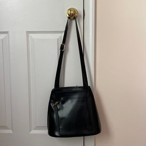 Genuine longchamp black purse.Two inside pockets one outside.